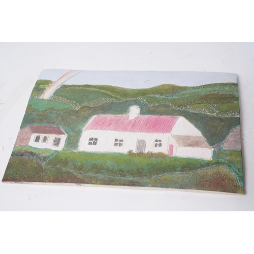 356 - A pebble stone with a painting of lighthouse and another hand painted tile of a cottage.