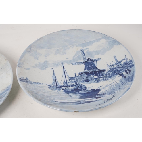 377 - A pair of antique blue and white patterned plates.