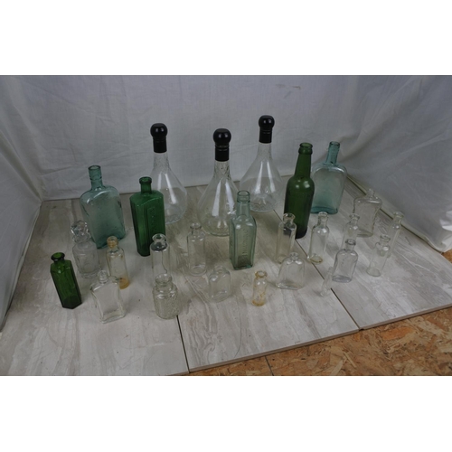 409 - A large lot of various collectors bottles.