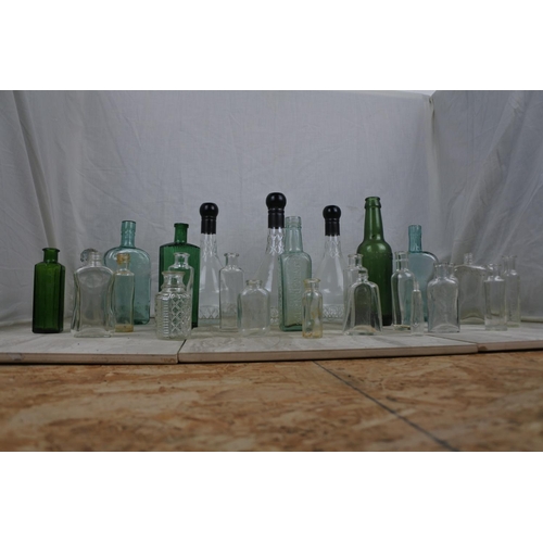 409 - A large lot of various collectors bottles.