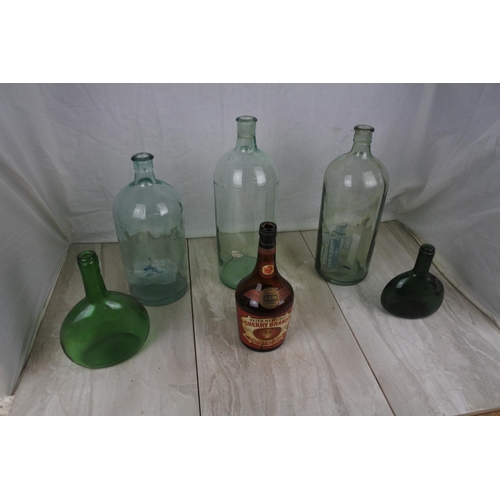 417 - Three large clear glass bottles and more.