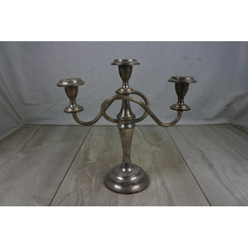 427 - A three branch silver plated candelabra.