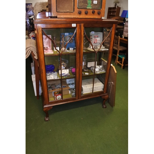 433 - A mahogany china cabinet on ball and claw feet, measuring 88cm x 122cm x 32cm.