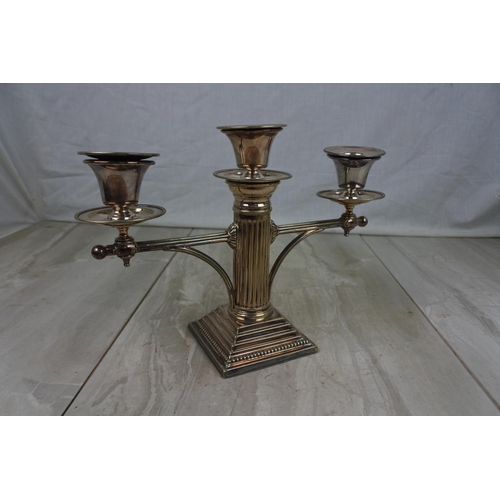 438 - A stunning pair of silver plated column candelabra's, measuring 19cm tall.