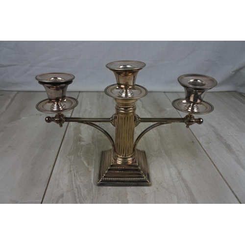 438 - A stunning pair of silver plated column candelabra's, measuring 19cm tall.