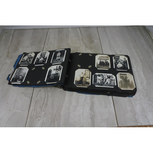 439 - A vintage photograph album and contents.