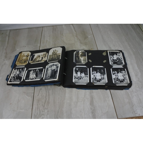 439 - A vintage photograph album and contents.