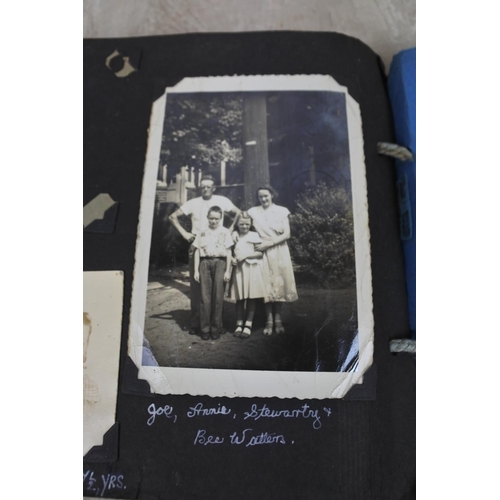 439 - A vintage photograph album and contents.