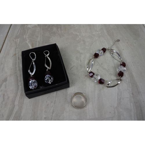 440 - A Sterling Silver ring and a matching earring and bracelet set.