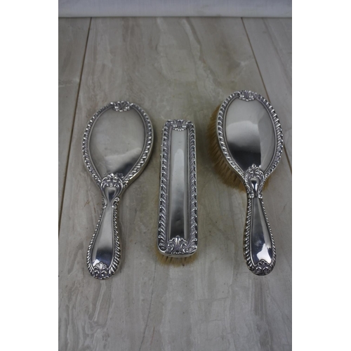 443 - A stunning three piece Sterling Silver dressing table set.