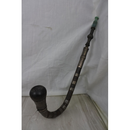 448 - A stunning antique opium pipe with silver plated bands.