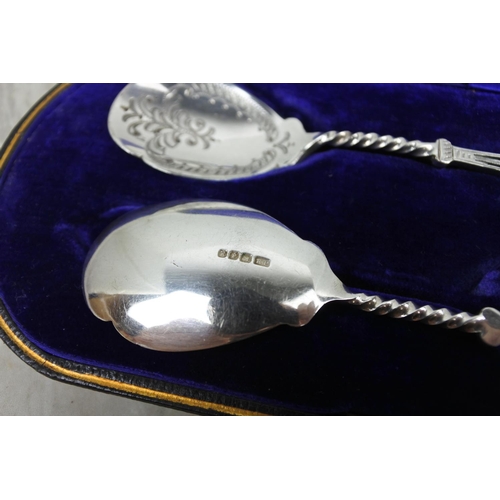 454 - A stunning cased pair of silver plated spoons.