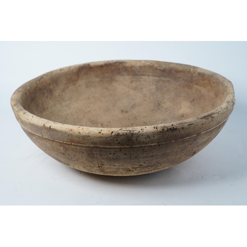 A stunning large antique Irish wooden bowl, measuring 43cm diameter.