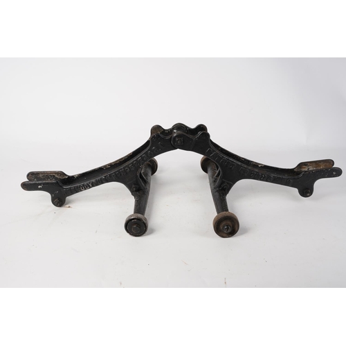 578 - A stunning antique cast iron bicycle stand, inscribed, 