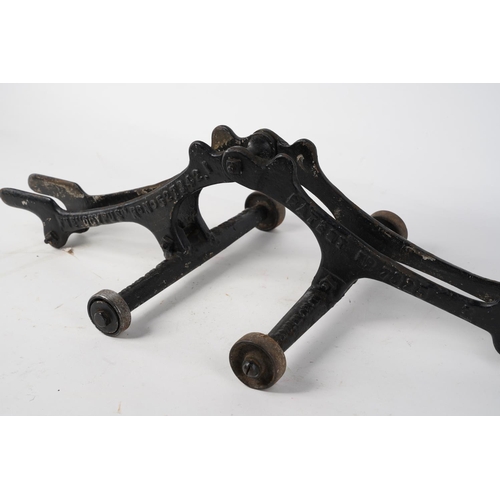 578 - A stunning antique cast iron bicycle stand, inscribed, 