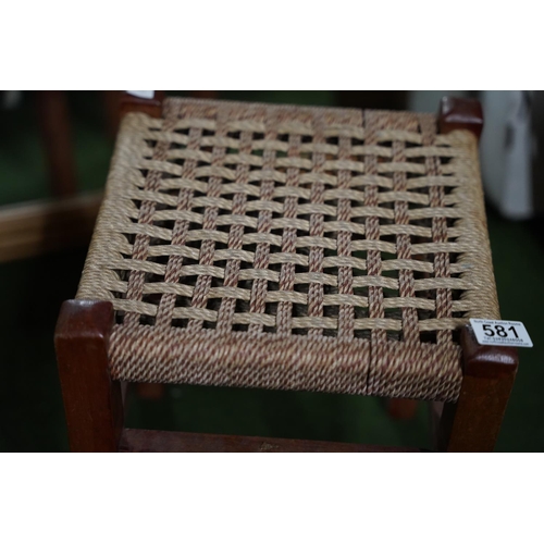 581 - A vintage woven topped stool.