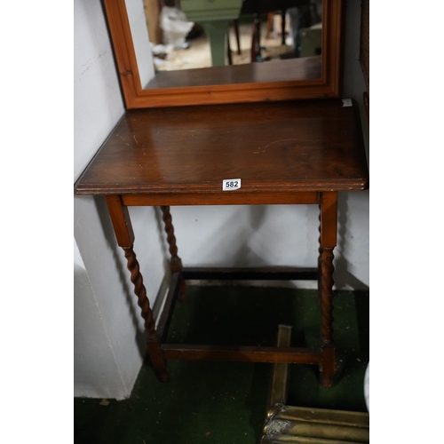 582 - An oak occasional table with barley twist detail.