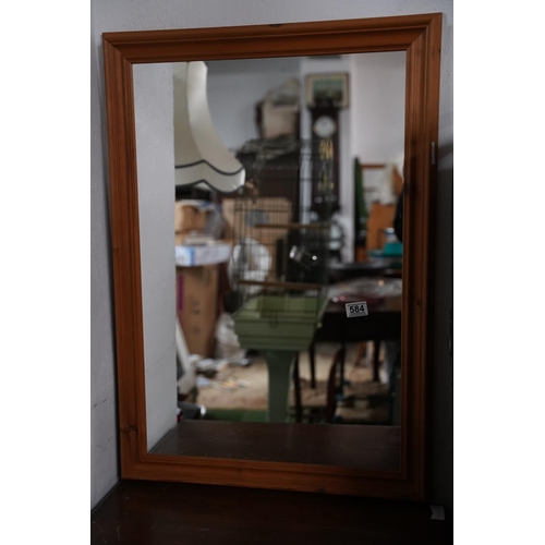 584 - A pine framed mirror.