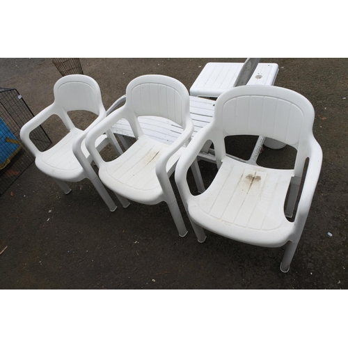 756 - A set of three plastic garden chairs.