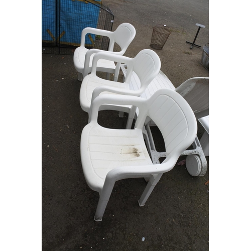 756 - A set of three plastic garden chairs.