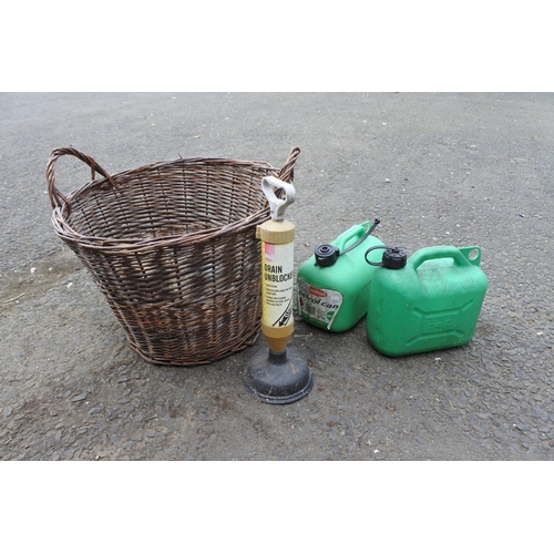 759 - A log basket, two plastic petrol cans and a drain unblocker.