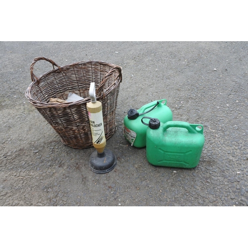 759 - A log basket, two plastic petrol cans and a drain unblocker.