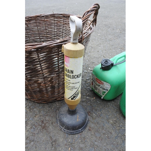 759 - A log basket, two plastic petrol cans and a drain unblocker.