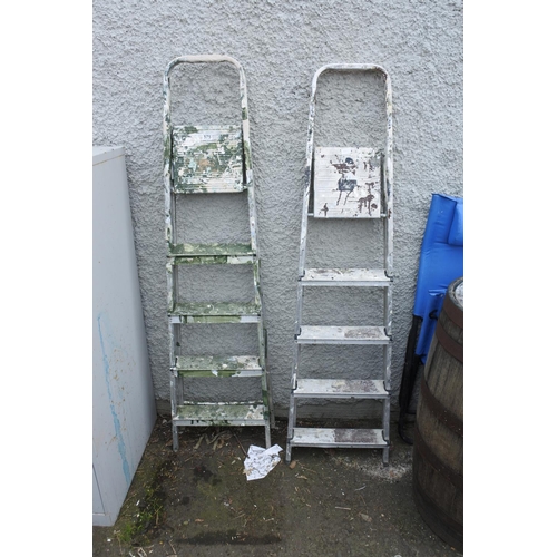 777 - Two metal step ladders.