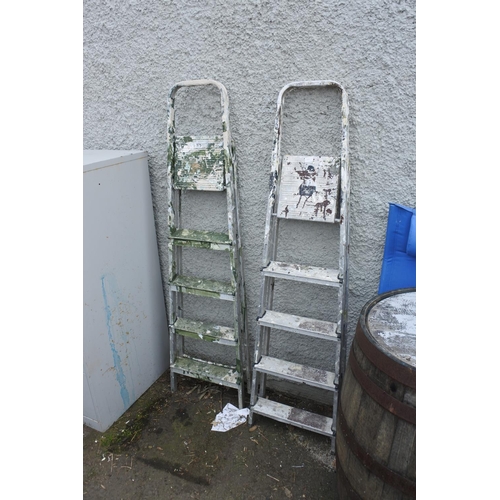 777 - Two metal step ladders.