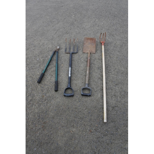 782 - A garden fork, spade and more.