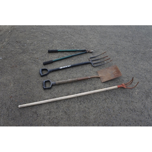 782 - A garden fork, spade and more.