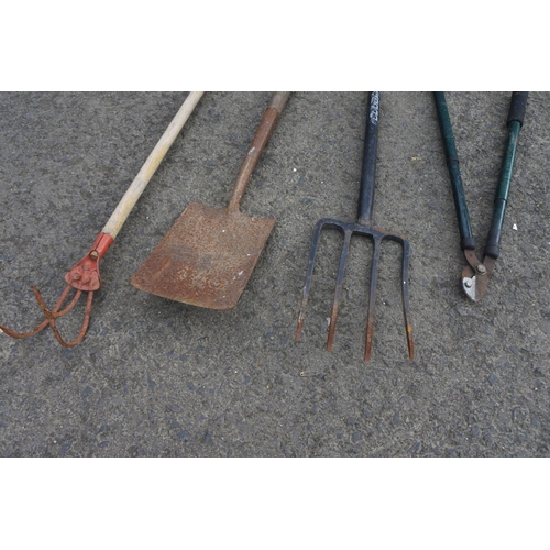 782 - A garden fork, spade and more.