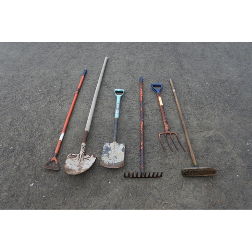 783 - A garden fork, spade and more.