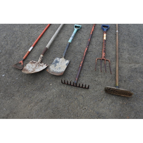 783 - A garden fork, spade and more.