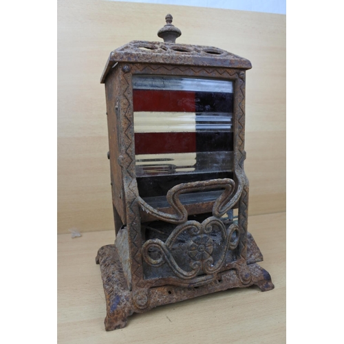 1183 - An antique Wright & Butler stove with a coloured panel stove. (a/f)