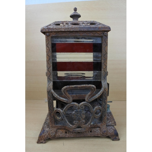 1183 - An antique Wright & Butler stove with a coloured panel stove. (a/f)