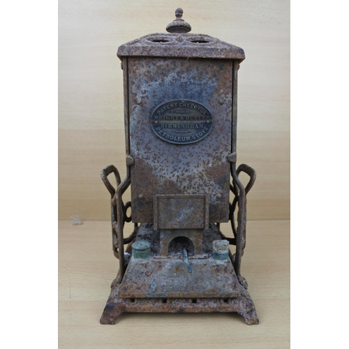 1183 - An antique Wright & Butler stove with a coloured panel stove. (a/f)