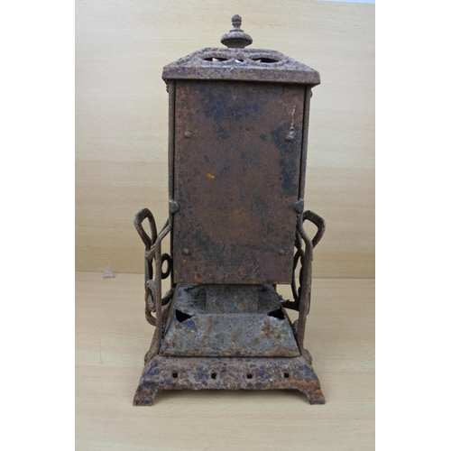 1183 - An antique Wright & Butler stove with a coloured panel stove. (a/f)