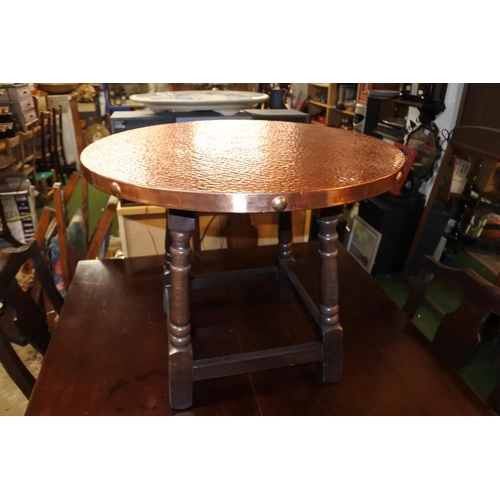 1184 - A stunning copper beaten topped occasional table.