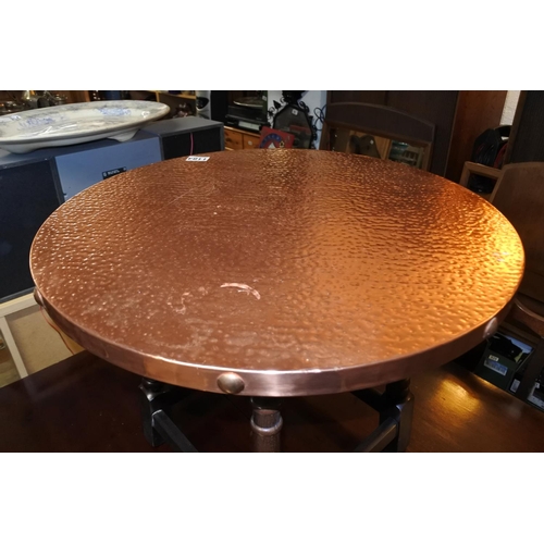 1184 - A stunning copper beaten topped occasional table.