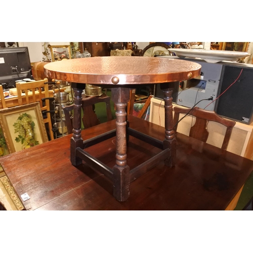 1184 - A stunning copper beaten topped occasional table.