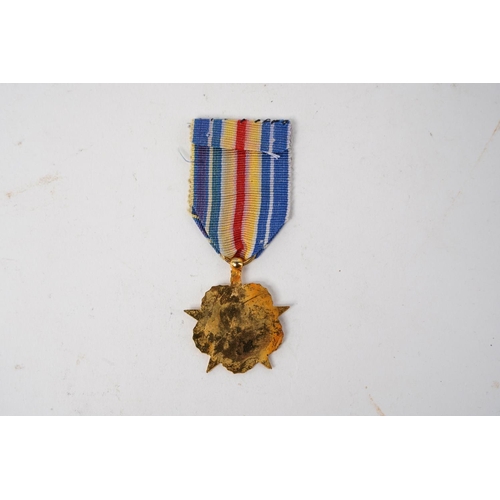 669 - A French 'War Wounded Star' medal.