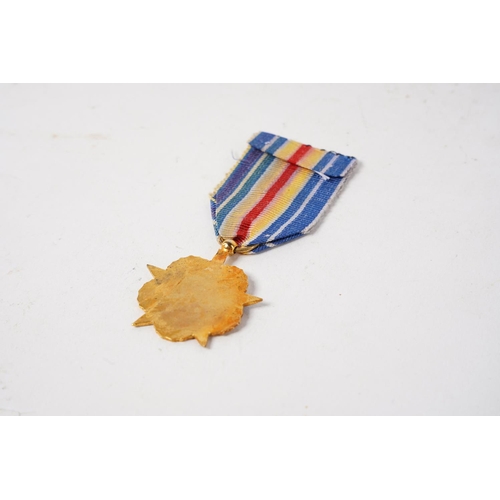 669 - A French 'War Wounded Star' medal.