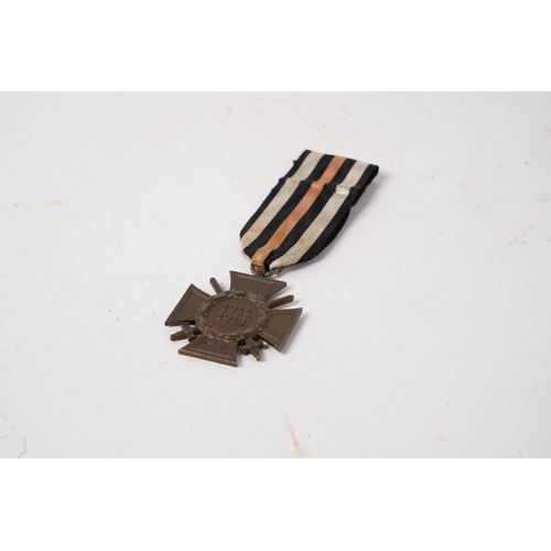 704 - A German Imperial Honour Cross Medal, 1914-1918, with Swords for Combatants.