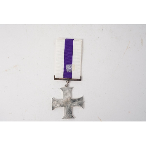 708 - A reproduction Military Cross medal.