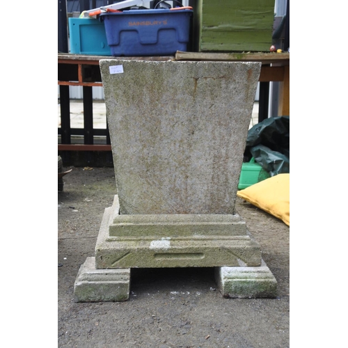 770 - A large pair of concrete planters on a plinth base and feet, measuring 27