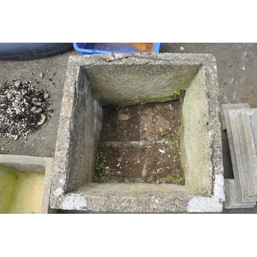 770 - A large pair of concrete planters on a plinth base and feet, measuring 27