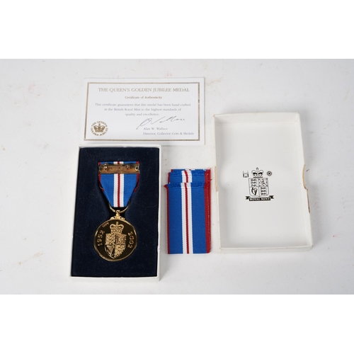 597 - A Queen Elizabeth II Golden Jubilee Medal, 2002, with original Royal Mint box.