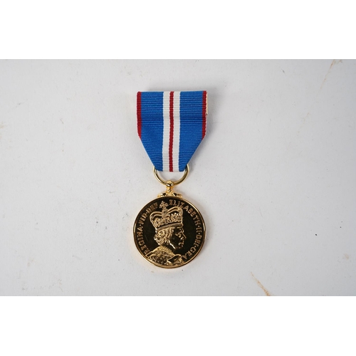 597 - A Queen Elizabeth II Golden Jubilee Medal, 2002, with original Royal Mint box.