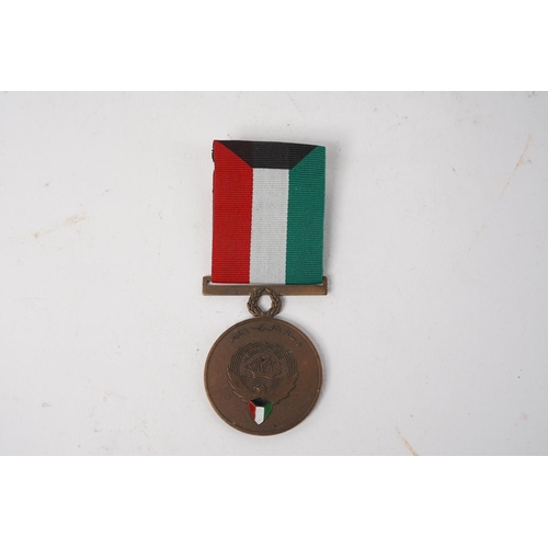 679 - A Kuwait Liberation Medal.